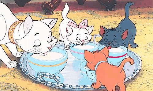 a group of cartoon cats drinking from cups on a silver tray