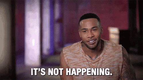 a man is sitting in a room and saying `` it 's not happening . ''