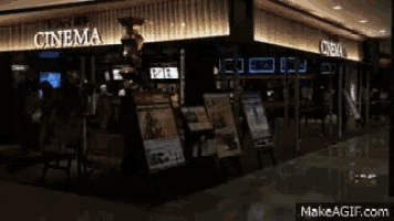 the inside of a movie theater with a sign that says cinema on it