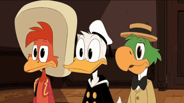 three cartoon characters are standing next to each other and one of them has the letter z on his chest