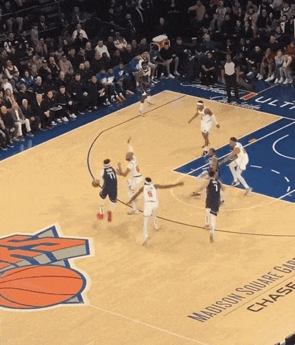a basketball game is being played on a madison square chase court