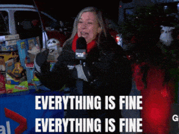 a woman holding a microphone with the words everything is fine above her