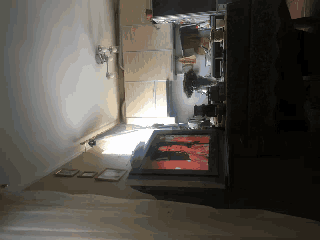 a flat screen tv is sitting on a table in a room