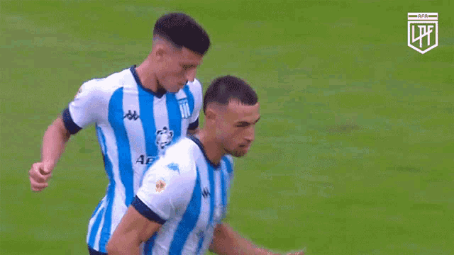 a soccer player wearing a blue and white striped shirt with the word lpfl on the front