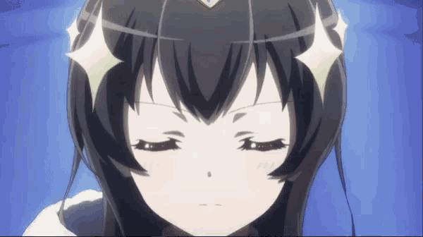 a girl with a crown on her head looks down with her eyes closed