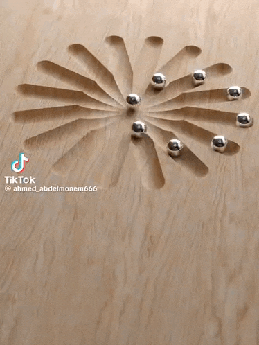 a wooden surface with a circular pattern and the word sanyo on the bottom