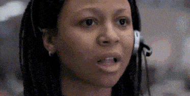 a close up of a woman wearing a headset .