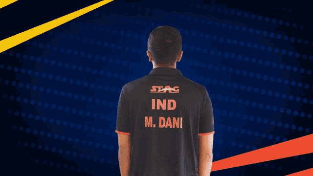 a man wearing a black shirt with the name m. dani on the back
