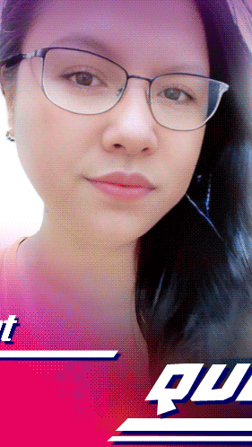a woman wearing glasses stands in front of a red and blue background with the word quil on it