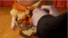 a person is putting a badge on a child 's uniform