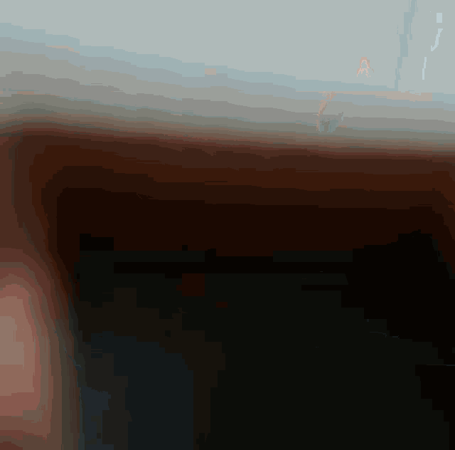 a blurred image of a person 's face with a gray background