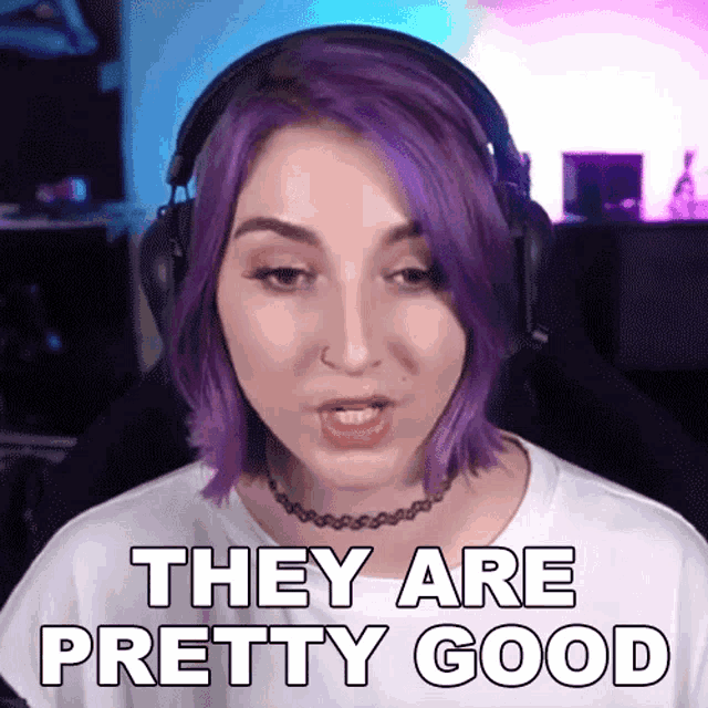 a woman with purple hair is wearing headphones and saying they are pretty good
