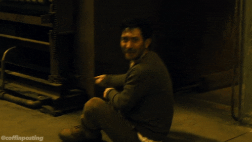 a man is sitting on the floor with his mouth open and the words @coffinposting written below him
