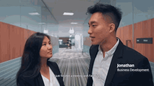 a man and a woman are standing next to each other and jonathan business development is written on the bottom