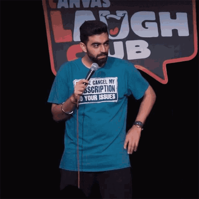a man in a blue shirt that says cancel my subscription to your issues
