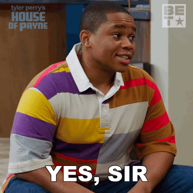 a man in a striped shirt sits on the floor with the words yes sir above him