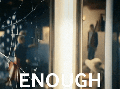 the word enough is on a poster with a broken glass