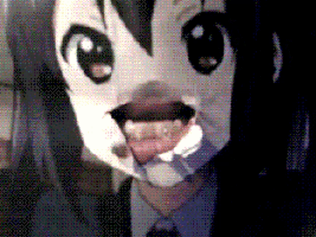 a close up of a person 's face with a cartoon face on it