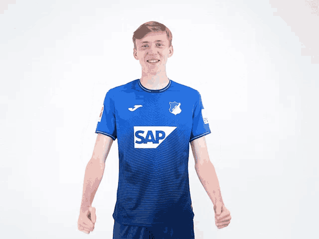 a man wearing a blue shirt with the word sap on the front