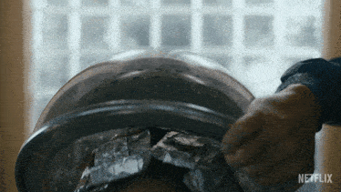 a close up of a person 's head with netflix written on the bottom