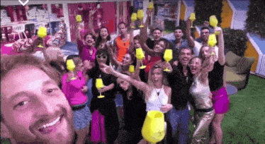 a group of people are posing for a picture with wine glasses in the air