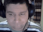 a man wearing headphones with a microphone on his head .