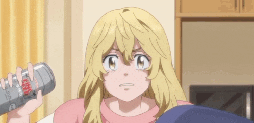 a blonde anime girl is holding a can of soda and looking at the camera .