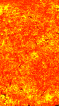 a close up of a red and yellow background with a texture