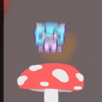 a red mushroom with white spots and a purple object on top of it