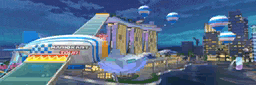 a blurred image of a city at night with a building that says mario kart
