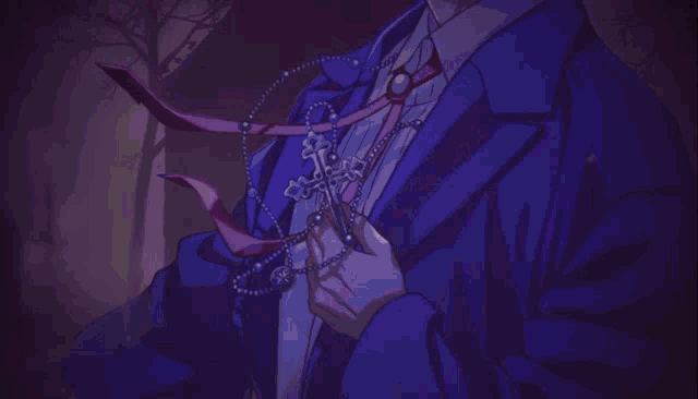 a man in a blue suit stands in a dark room