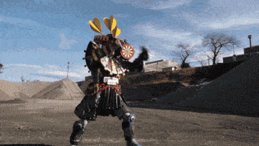 a robot with a dart board on his head is standing in a gravel area