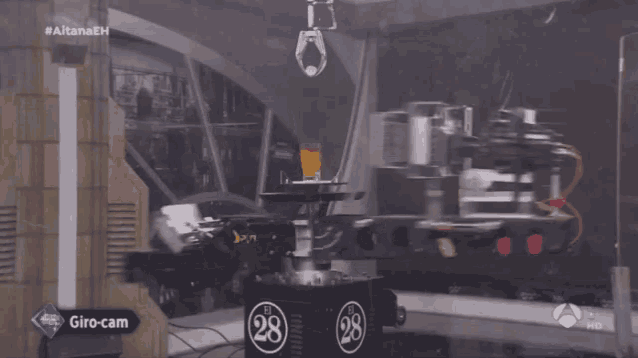 a machine with the number 28 on it is on a tv screen