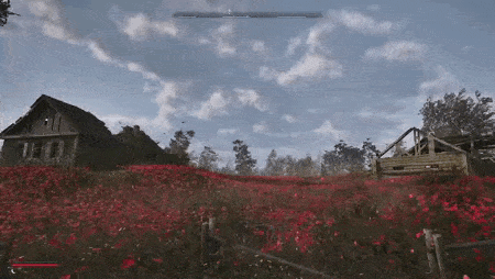 a video game scene with a house in the background and a field of red flowers .