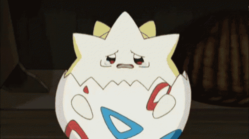 a cartoon character is crying while sitting in a egg .