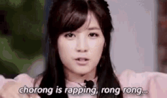 a woman says chorong is rapping rong rong in front of a microphone