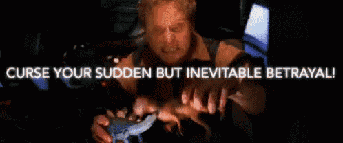 a man is holding a dinosaur with the words curse your sudden but inevitable betrayal written above him