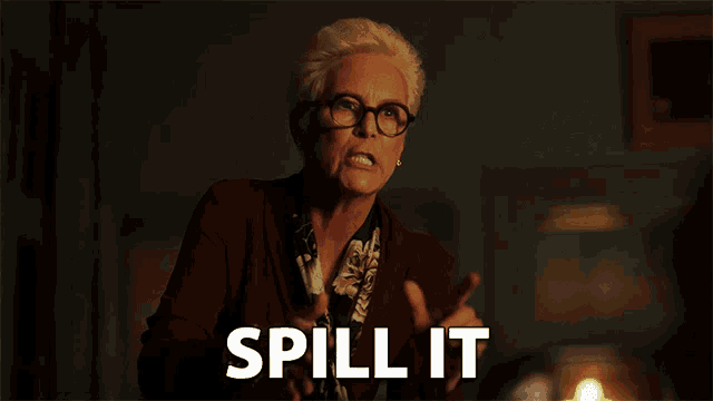 an older woman with glasses says spill it