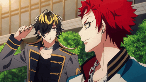 a man with red hair is standing next to another man with black hair