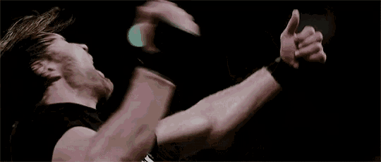 a man is giving a thumbs up sign with his arms outstretched