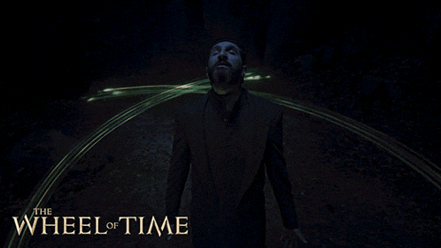 a poster for the wheel of time shows a man in a black suit