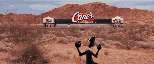 a cartoon duck stands in front of a canes sign