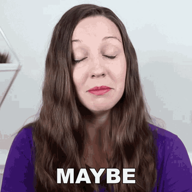a woman in a purple shirt has her eyes closed and the word maybe is on her face