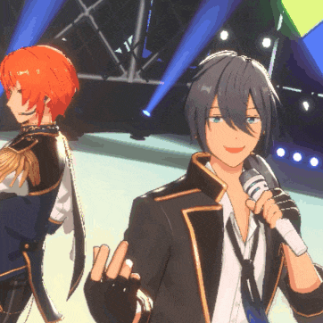 a man holding a microphone stands next to another man with orange hair