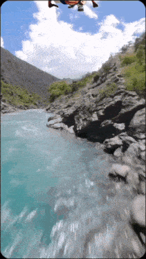 a person is doing a handstand over a body of water