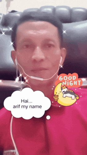 a man wearing a headset with a good night sticker on his face