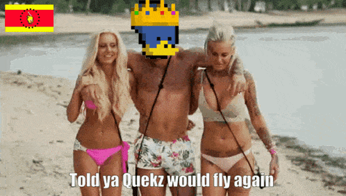 a man with a crown on his head is surrounded by two women on a beach