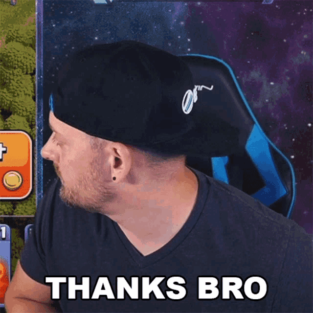 a man wearing a hat and a black shirt says thanks bro