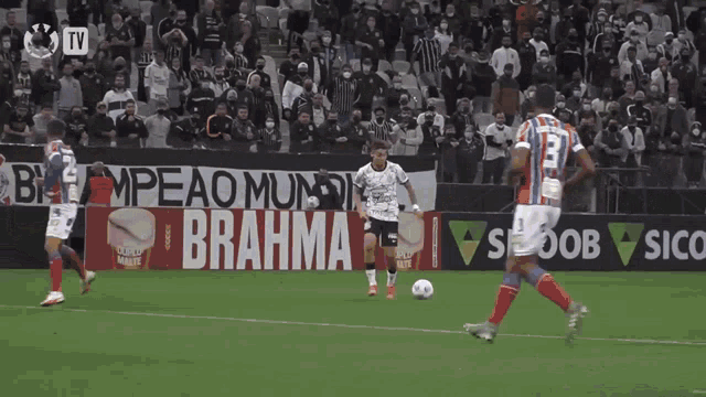 soccer players on a field with a banner that says brahma