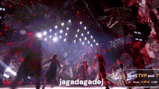 a group of people dancing on a stage with jagadagadej written on the bottom right